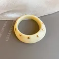 Vintage cream resin chunky bangle with gold circular studs in a classic retro style - Studded Wide Style / 65# Bangle Gold White