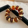 Vintage geometric amber resin bead bracelet with gold metal accents for a luxury look - Amber Geometric Beaded Style (65#手链) / Gold Brown