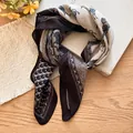 Close-up of vintage horse print square scarf with cotton-linen texture on a wooden desk - Gray Horse