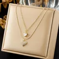 Macro detail of elegant double-layered gold necklace with sparkling heart pendants - Double Layer Full Pave Heart Choker (N4505)