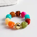 Detailed view of vibrant marbled acrylic geometric beads on a vintage style statement necklace. - Bracelet / Gold-Multicolor