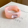 Detailed close-up of pink marbled resin bangle with a centered rectangular gemstone - 8# Bangle-Pink