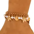 Macro view of gold anklet featuring star and shell pendants with elegant white pearls - Rhinestone Starfish Layered Style (M-178) / Gold