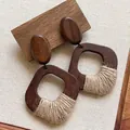 Detail of Bohemian dark wood earrings with raffia woven accents and natural texture. - Retro Wooden Wrapped Style (24#) / Brown