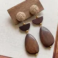 Macro detail of bohemian raffia woven studs with dark wood teardrop dangling charms - Rattan Ball Teardrop Wooden Style (22#) / Brown