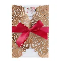 Luxury gold laser-cut rose wedding invitation card featuring an elegant red ribbon bow - Reflective Rose Gold