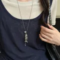 Silver fishbone pendant necklace worn over a navy blue tank top for a chic look - 40# Necklace-Silver