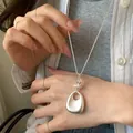 Elegant Korean style minimalist silver pebble pendant necklace shown on Asian model - 6# Necklace-Silver