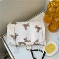 Portable white cosmetic bag with cute brown teddy bear print and adjustable elastic straps - Teddy Bear