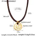 Detailed view of leopard print silk scarf necklace with golden spiral pendant and labels - Gold Spiral Geometric Style (P1166)