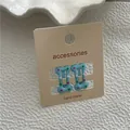 Mignon lot de deux barrettes à cheveux bleu clair à pois pour enfants sur sa carte - Bleu