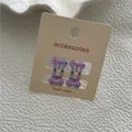 Barrettes à cheveux violettes en forme d'os avec des pois colorés pour filles - Violet