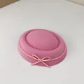 Close-up macro view of a sweet pink felt pillbox hat with a delicate bow detail - Pink Knot / One Size