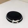 Elegant black velvet sailor hat with a white ribbon bow, perfect for JK style outfits. - Black And White Knots / One Size