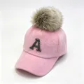 Close-up of pink furry baseball cap featuring a rhinestone letter A and a fluffy pom-pom. - Adult 58cm Adjustable / Rhinestone Letter A & Raccoon Fur Pom-pom Style / Pink