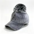 Close-up of a grey fuzzy baseball cap with a fluffy pom-pom and rhinestone letter A - Adult 58cm Adjustable / Rhinestone Letter A Style / Gray