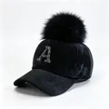 Close-up of black velvet baseball cap with rhinestone letter A and faux fur pom-pom - Adult 58cm Adjustable / Rhinestone Letter A Style / Black