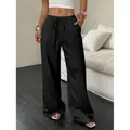 Pantalon large noir texturé pour femme avec taille à cordon et poches latérales - S / Bas / Noir