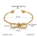 Verstellbarer Armreif aus Edelstahl mit geknoteter Schleife in elegantem Gold - Gold Schleife Armreif