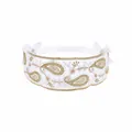 Detail of white lace headband for babies with gold paisley embroidery and satin bows. - MB083 / -