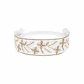 Detail view of a white lace kids' headband featuring gold flower embroidery and bows - MB085 / -