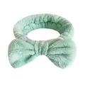 Fascia per lavaggio viso in flanella verde menta con fiocco decorativo per la cura della pelle - Una Fascia Per Capelli Con Fiocco Verde