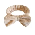 Fascia per capelli in flanella con fiocco beige per lavare il viso e truccarsi - Una Fascia Per Capelli Con Fiocco Beige
