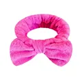 Morbida fascia per il lavaggio del viso in flanella magenta con un grande fiocco - Una Fascia Per Capelli Con Fiocco Rosso Rosa