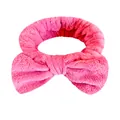 Fascia per capelli con fiocco in flanella rosa per skincare e trucco - Una Fascia Per Capelli Con Fiocco Rosso Anguria