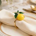 Elegant gold lemon napkin ring with green leaves for spring and summer table decor - Single Lemon Style