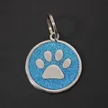 Blue glitter 30mm round pet ID tag with silver dog paw print design and metal ring - With Round Ring (HC537) / Light Blue