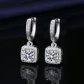 Macro view of elegant square silver drop earrings featuring sparkling moissanite stones - White Gold (Pair)