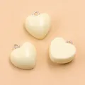 Creamy yellow heart-shaped resin pendants with silver loops for DIY jewelry making - 1 Piece / Rice White (22E13)