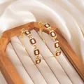 Fashionable gold-plated hoop earrings with brown enamel football charms for sports fans - Drip Oil Hoop Earrings (E8329)