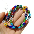 Gros plan de perles de verre colorées en forme d'œil maléfique pour bijoux DIY créés - Multicolore