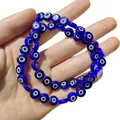 Vue détaillée de perles en verre œil grec bleu foncé pour la création de bijoux DIY - Bleu Saphir