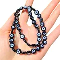 Détail macro de perles de verre noires œil grec pour la création de bijoux DIY - Noir