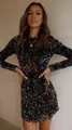 Close-up detail of a glamorous iridescent sequined long-sleeved mini dress for evening parties - XS / Top And Bottom / Iridescent Black