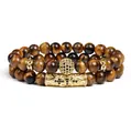 Close-up detail of two-piece 8mm tiger eye bead bracelets with gold micro-pave crown spacers - Black Gunmetal Accessory Style (g357-1) / Set of 2