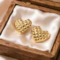 Detail view of quilted gold heart earrings presented in a luxury wooden jewelry gift box - Quilted Heart Earrings