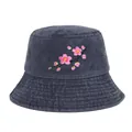 Detailed macro view of delicate pink cherry blossom embroidery on dark denim bucket hat - Navy Blue