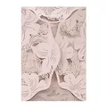 Close-up detail of an elegant light pink laser-cut floral pattern wedding invitation card - Nude Pink