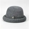 Detailed view of grey winter knit bucket hat with fuzzy texture and elegant gold M logo - M (56-58cm) / Gray (With M Logo)
