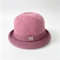 Detailed view of a pink fuzzy knit bucket hat featuring a gold M logo and a curled brim - M (56-58cm) / Dusty Pink (With M Logo)