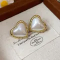 Elegant heart-shaped gold-plated stud earrings with a pearlescent center insert - 23 Silver Earring Post-Gold