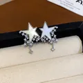 Elegant silver plated star stud earrings with sparkling zircon and pearl inlay details - Silver