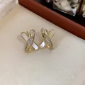Elegant gold-plated cross earrings featuring sparkling zircons and white shell inlay detail - 20 Silver Needles - Gold
