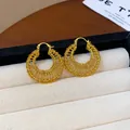 Elegant gold-plated woven hoop earrings featuring intricate metal wire textures - 28 Earrings - Gold