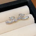 Minimalist silver-plated twisted knot stud earrings for an elegant and sophisticated look - 41 Silver Needles - Silver
