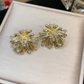 Elegant gold-plated firework star stud earrings with sparkling white zircon stones for women - 60 Silver Pin - Gold